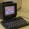 ZX Spectrum Computer and Roadster TV Sitting on a Table.